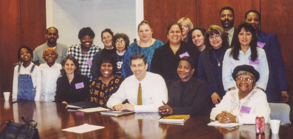A group of COFI parents and staff with Chicago Public Schools CEO Arne Duncan 