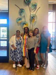 Five women standing for a group picture