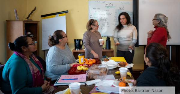 A group of Latina parent leaders gather at a meeting