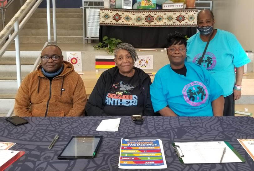 A group of Latina parent leaders gather at a meeting