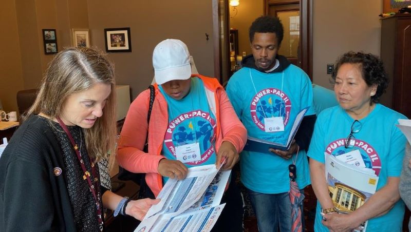 Three parent leaders lobby and talk to a legislator