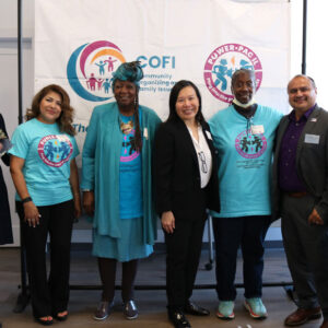 Seven adults standing for a group picture - Dr. Gina Lowell, Lili Olayo, Mamie Cosey, Jadine Chou, Charlene Campbell, Casildo Casey Cuevas, and Katrina Falkner