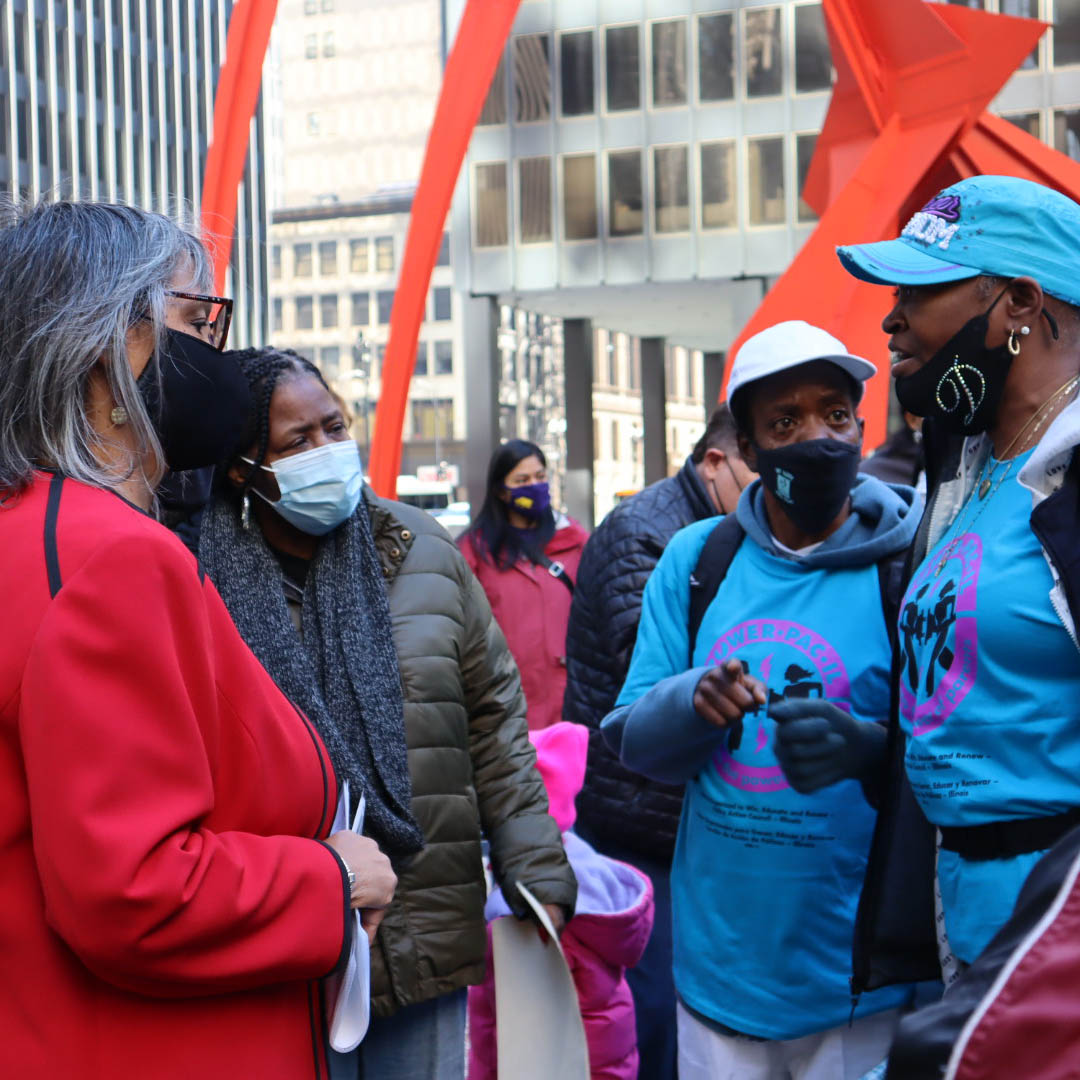 POWER-PAC IL leaders speak to an Illinois state legislator at a Chicago rally