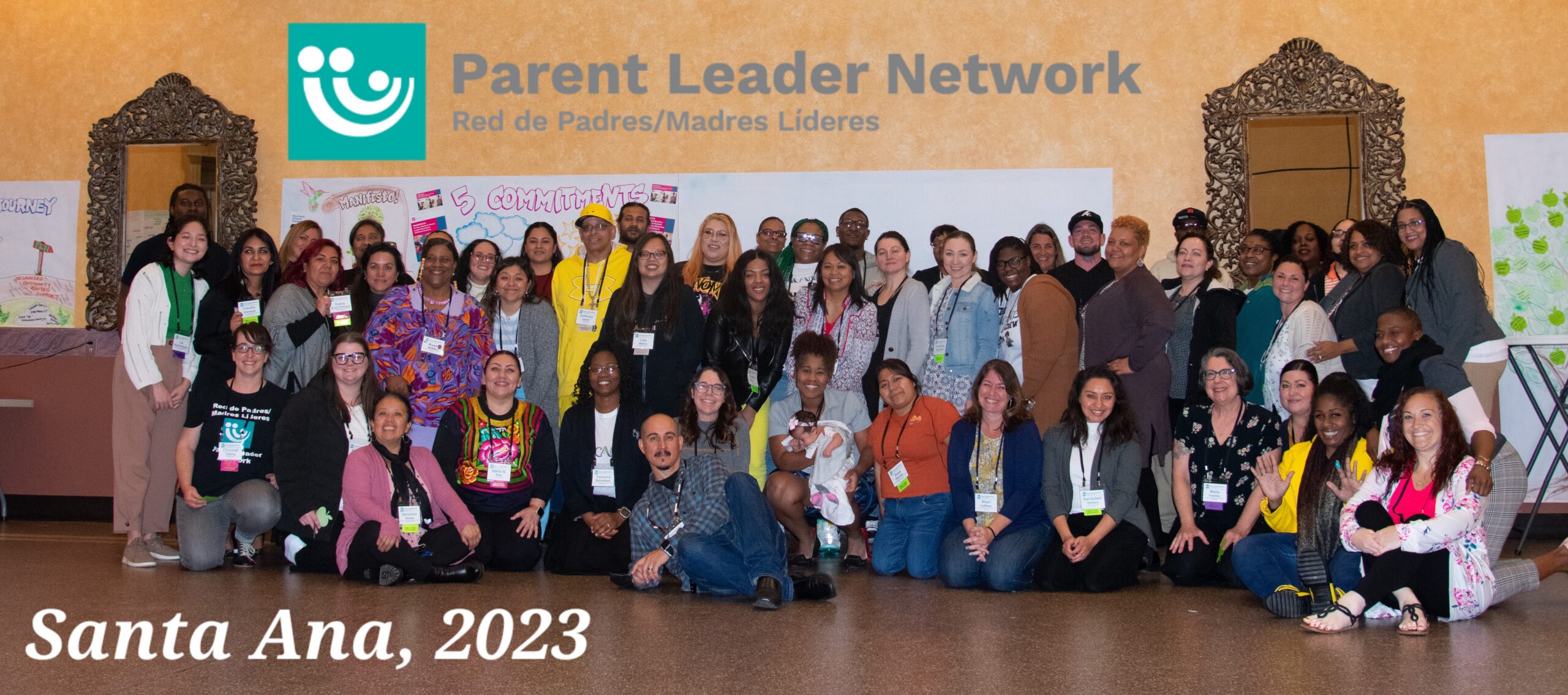A large group photo of diverse Black and Brown parent leaders