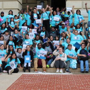 A large group photo of parent leaders and children