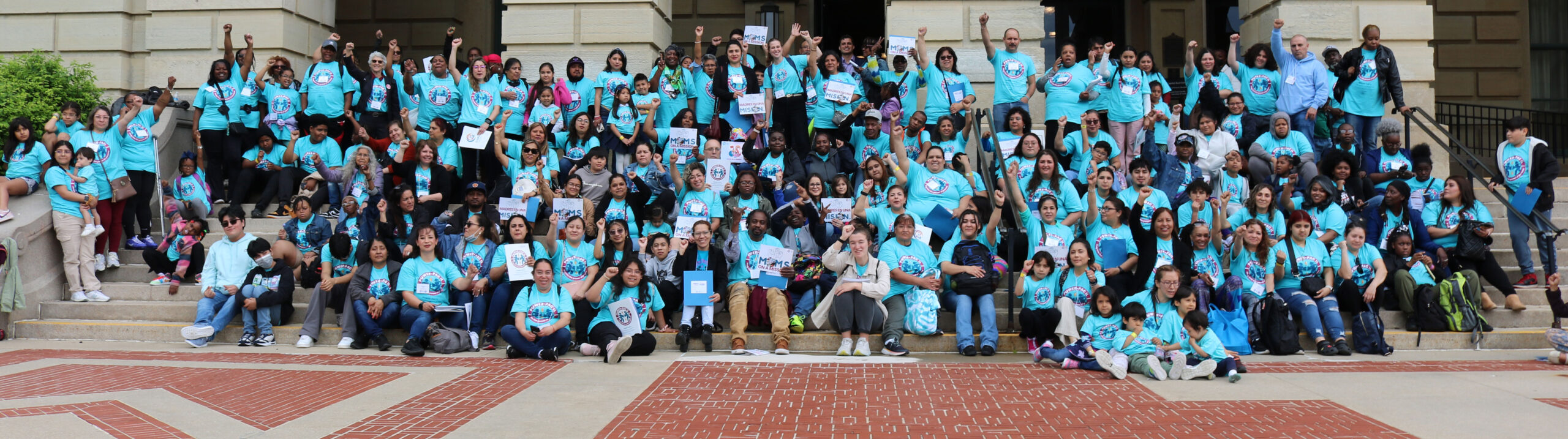 A large group photo of parent leaders and children